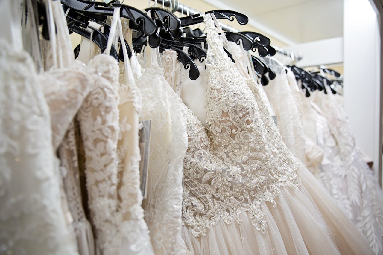 Beautiful lace wedding dresses on display in a bridal boutique, showcasing intricate designs and elegance.